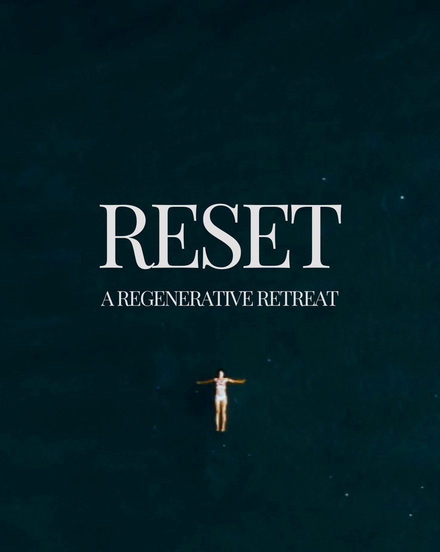 Reset, a regenerative retreat: a swimmer floating in dark water, seen from above